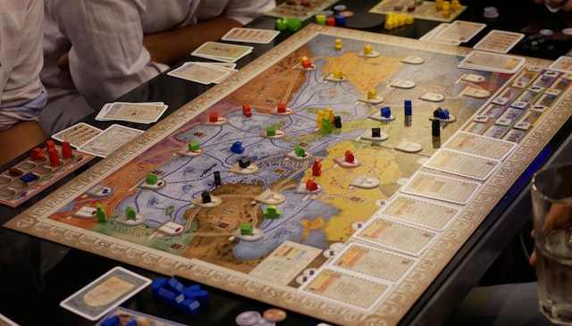 What is the goal of interactive board games?